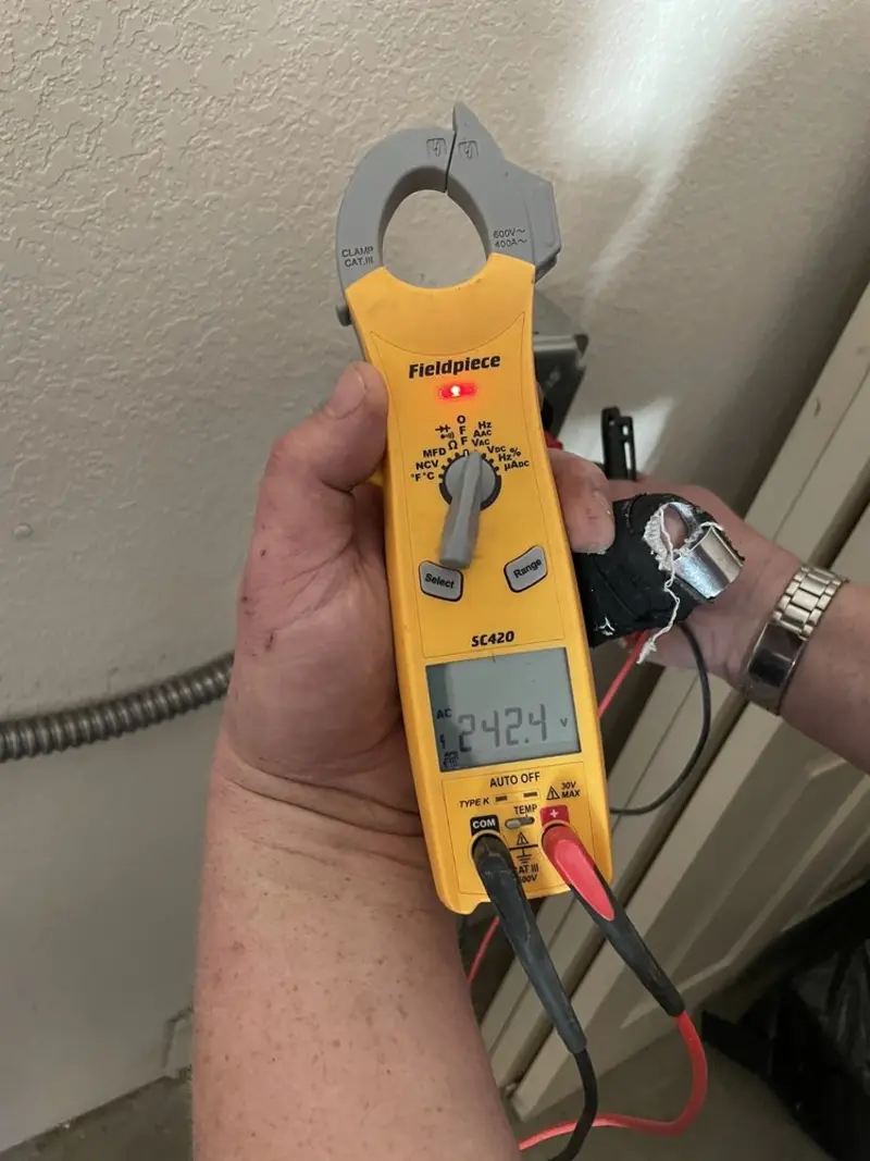 Voltage testing with clamp meter during Electrical Installation Services in Alcoa